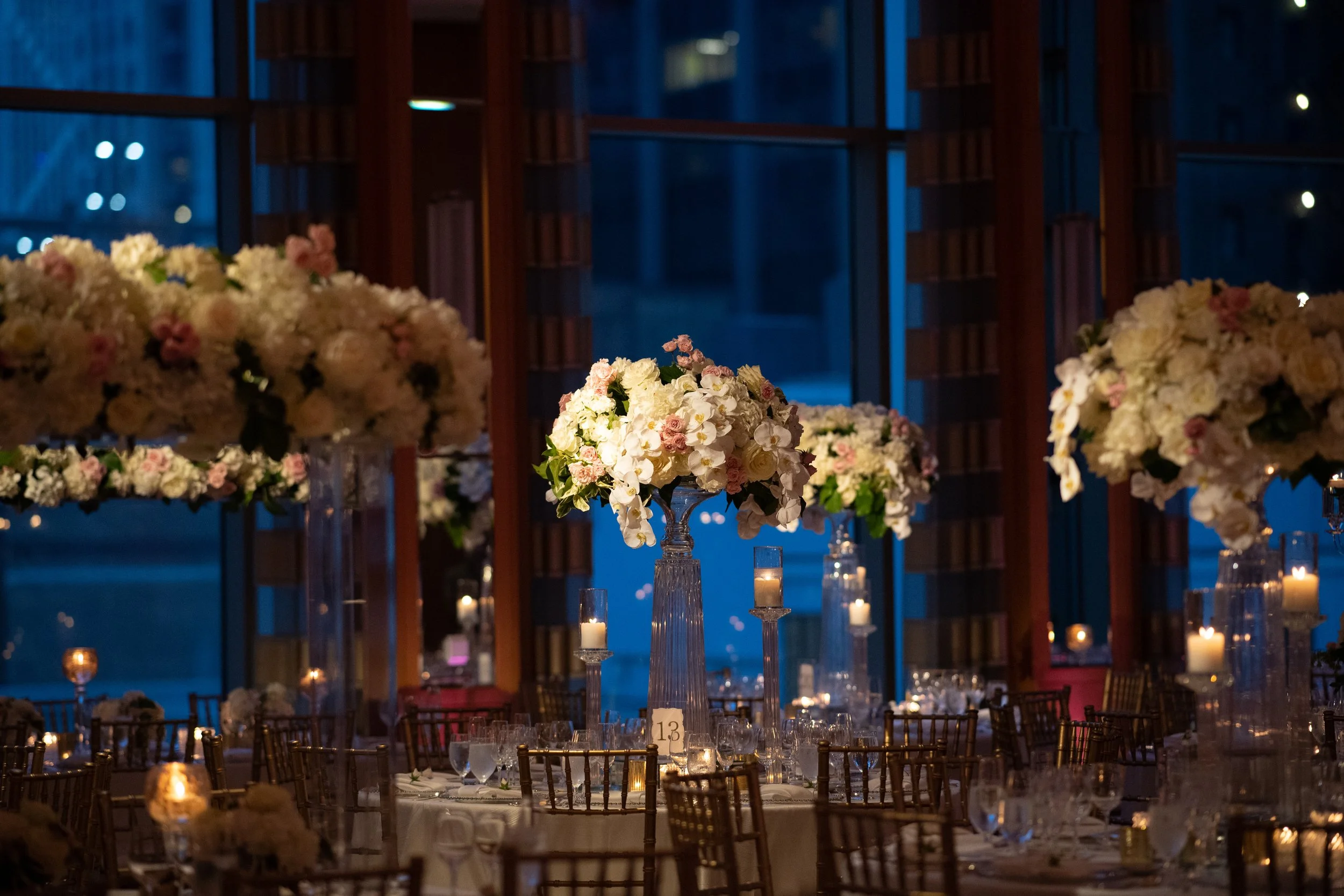 Candlelit guest tables overlooking Chicago at Alexis and Michael's wedding