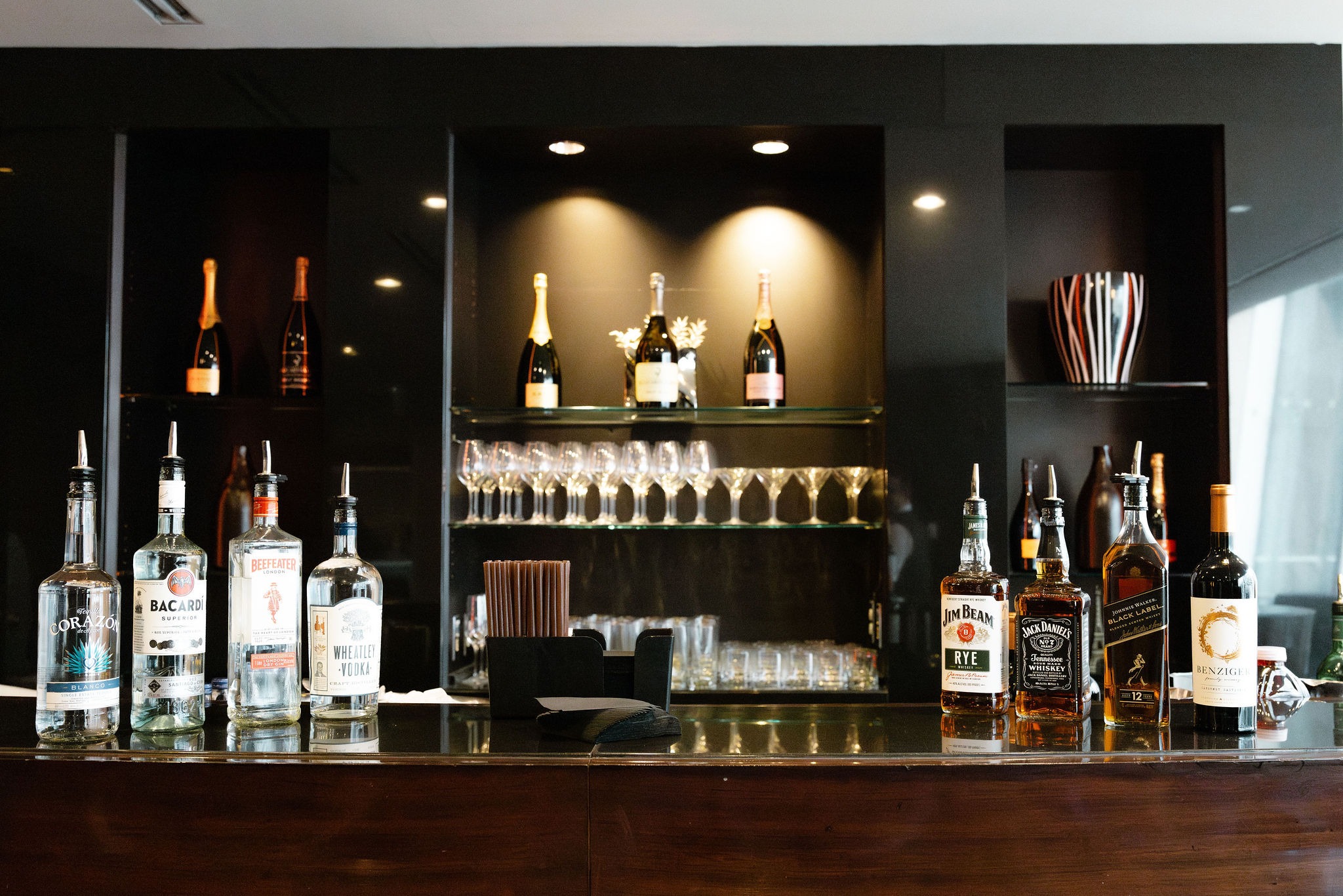 Stocked bar with champagne and spirits ready for the conference reception