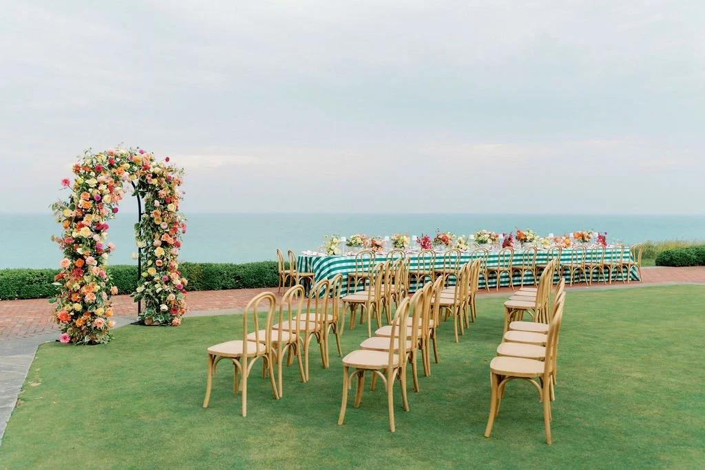 Lakeside ceremony arch and reception table at Shoreacres for Lisa and Matt