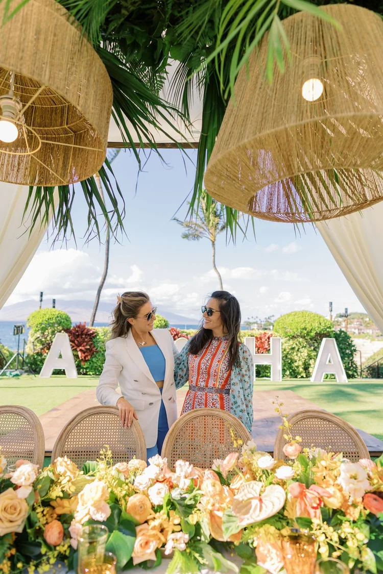 Brianne Garritano with a collaborator at a tropical ALOHA celebration