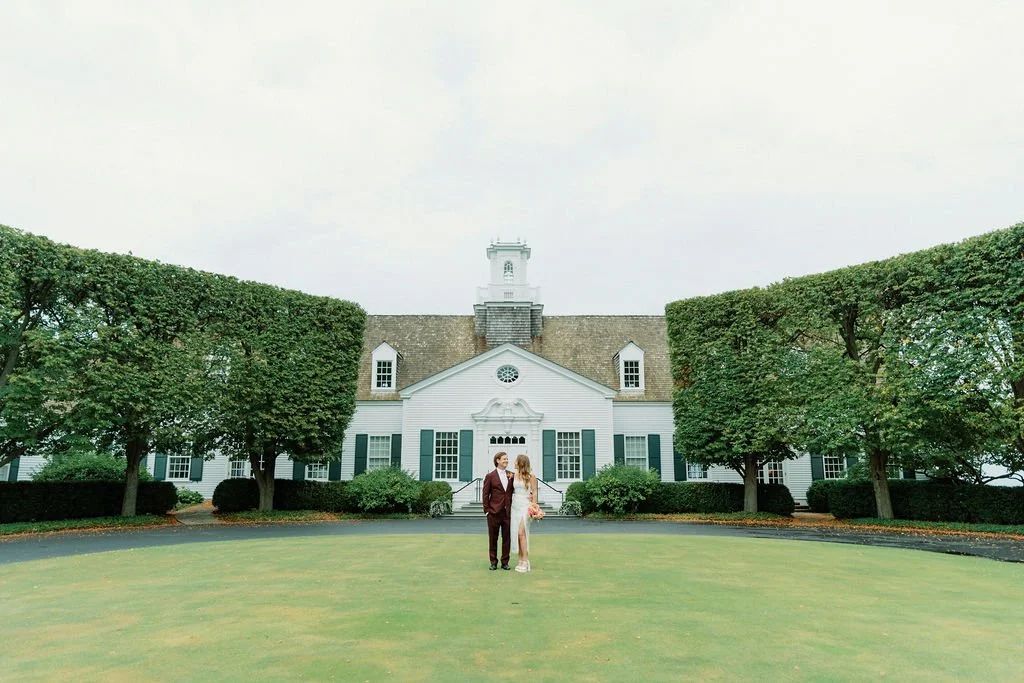 Lisa and Matt on the lawn in front of Shoreacres Country Club